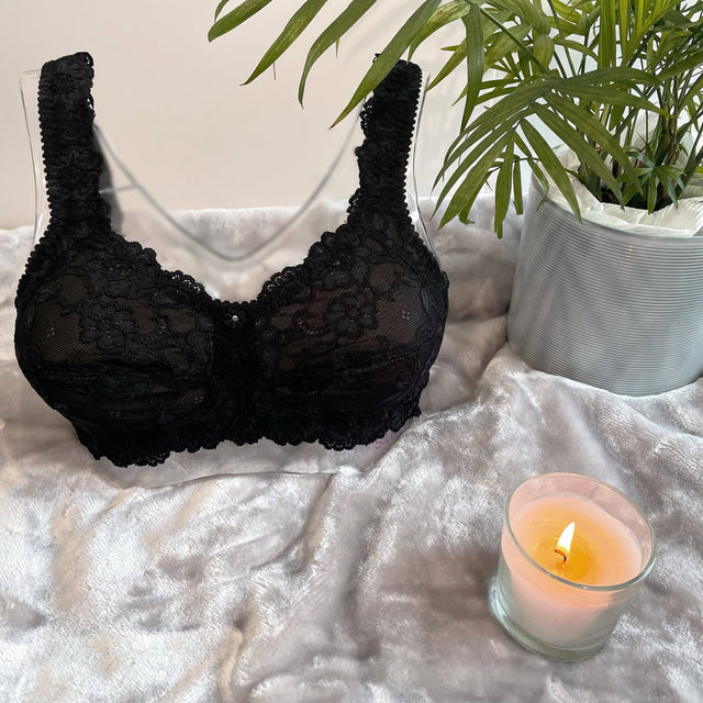 Front on picture of our wire-free mastectomy bra, Flora. Flora is a black bra designed for comfort and support.