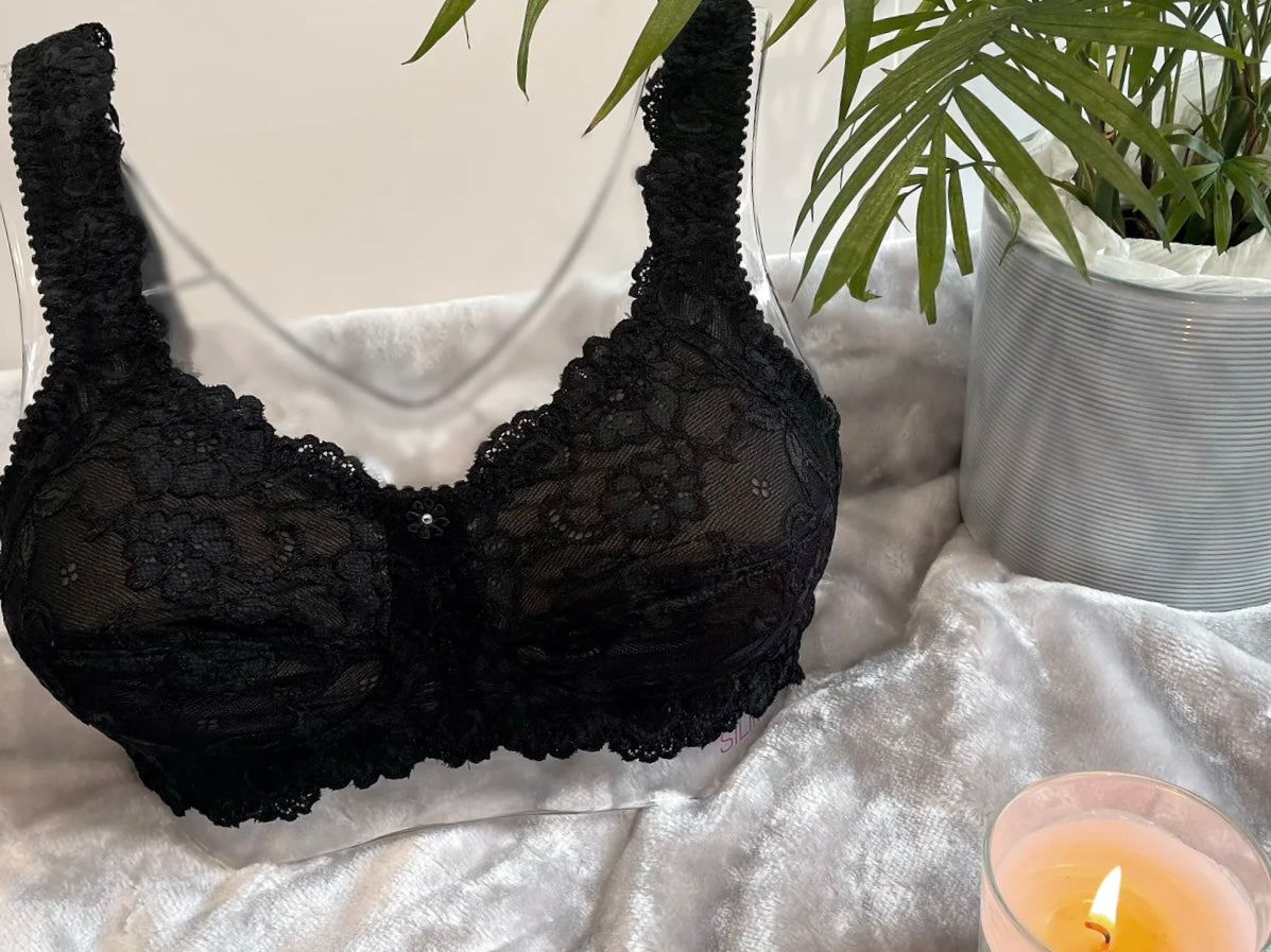 Front on picture of our wire-free mastectomy bra, Flora. Flora is a black bra designed for comfort and support.
