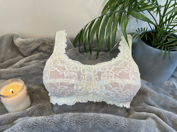Front on picture of our wire-free mastectomy bra, Flora. Flora is a white bra designed for comfort and support.