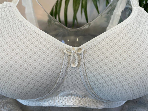 Anna Pocketed Wire-Free Mastectomy Bra in stylish geometric print with smooth moulded cups, side support, and adjustable straps.