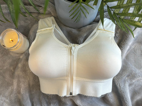 Cara post-surgery bra with moulded cups, wide straps, and front zipper closure.