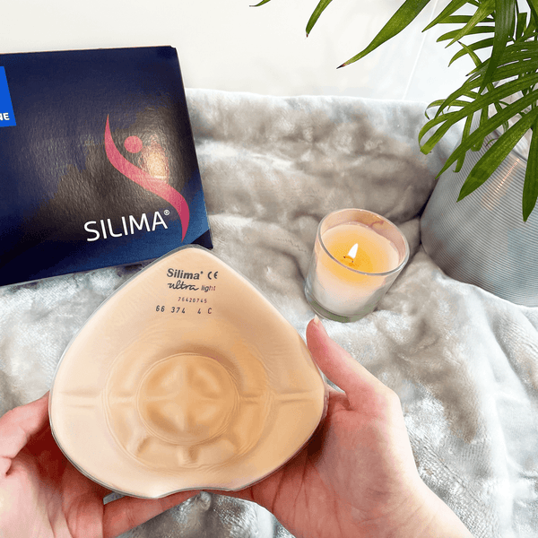 Ultra Light Breast Form prosthesis with lightweight silicone, showcased in hand for post-mastectomy comfort. Ideal for sensitive skin and lymphoedema.